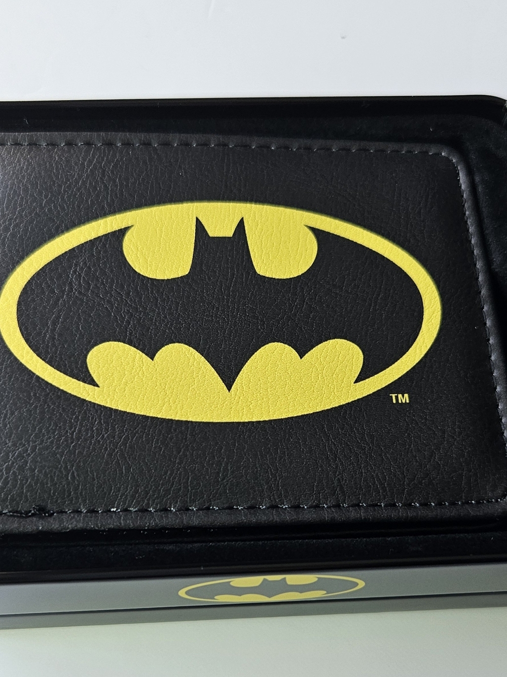officially licensed DC Comics Batman Bifold Wallet resting inside its protective